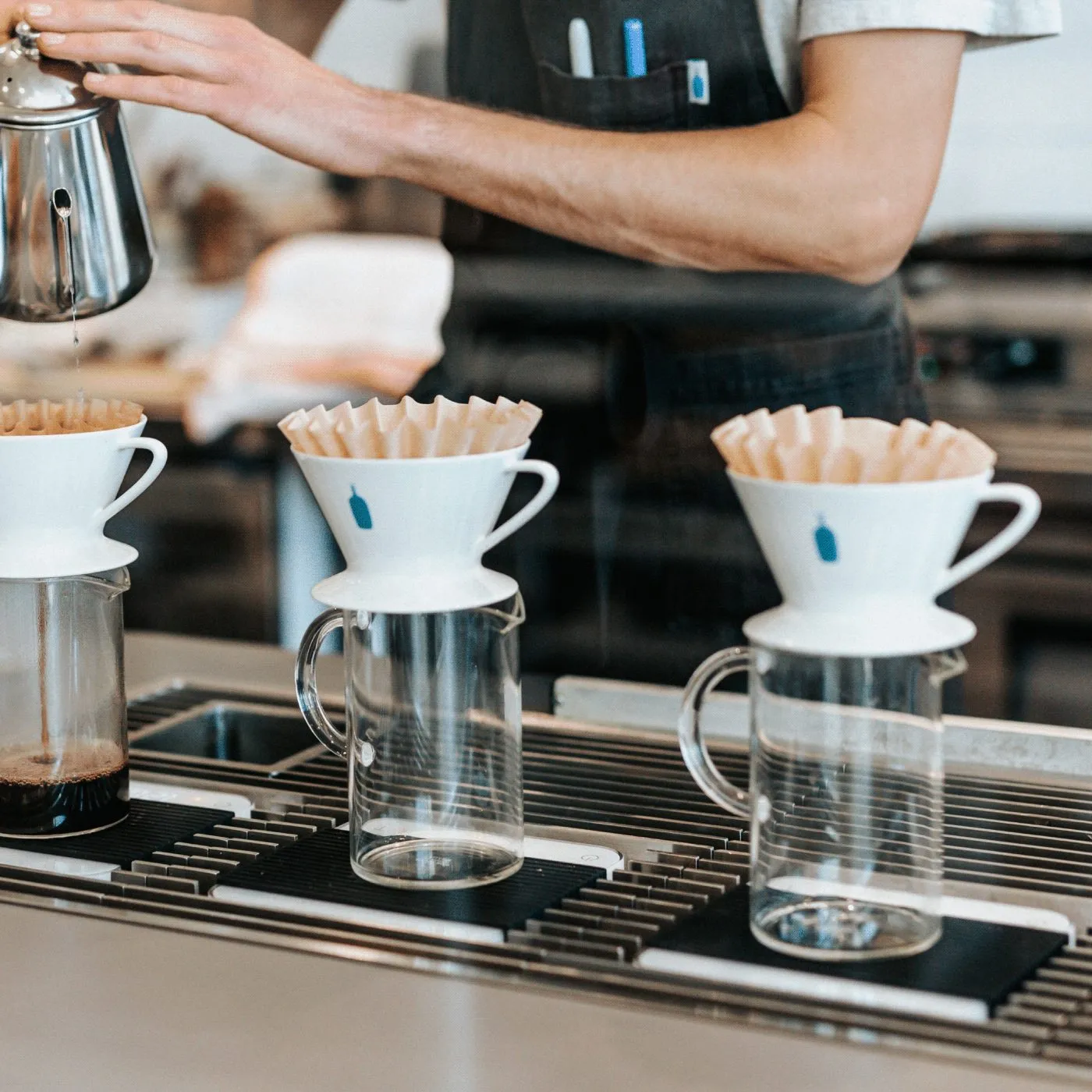 Barista pouring coffee