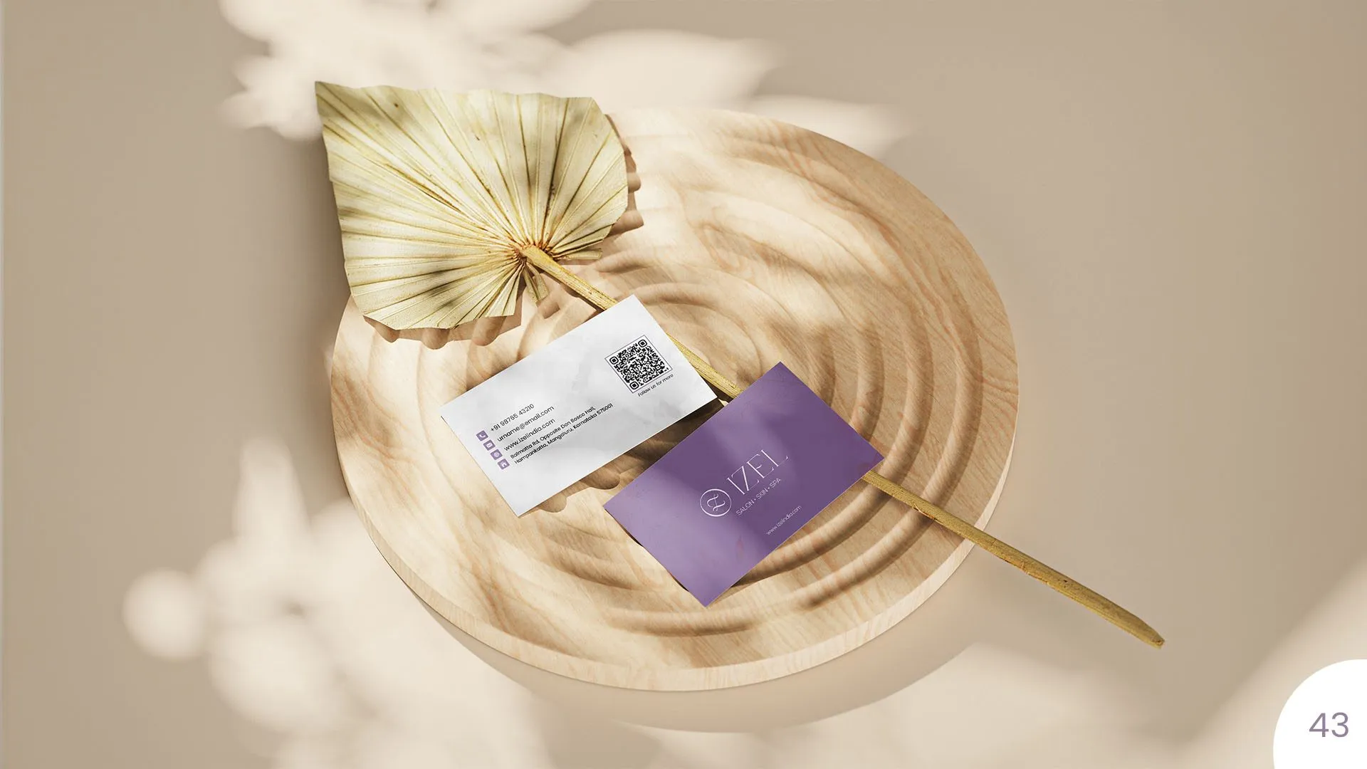 Izel business cards on a wooden tray
