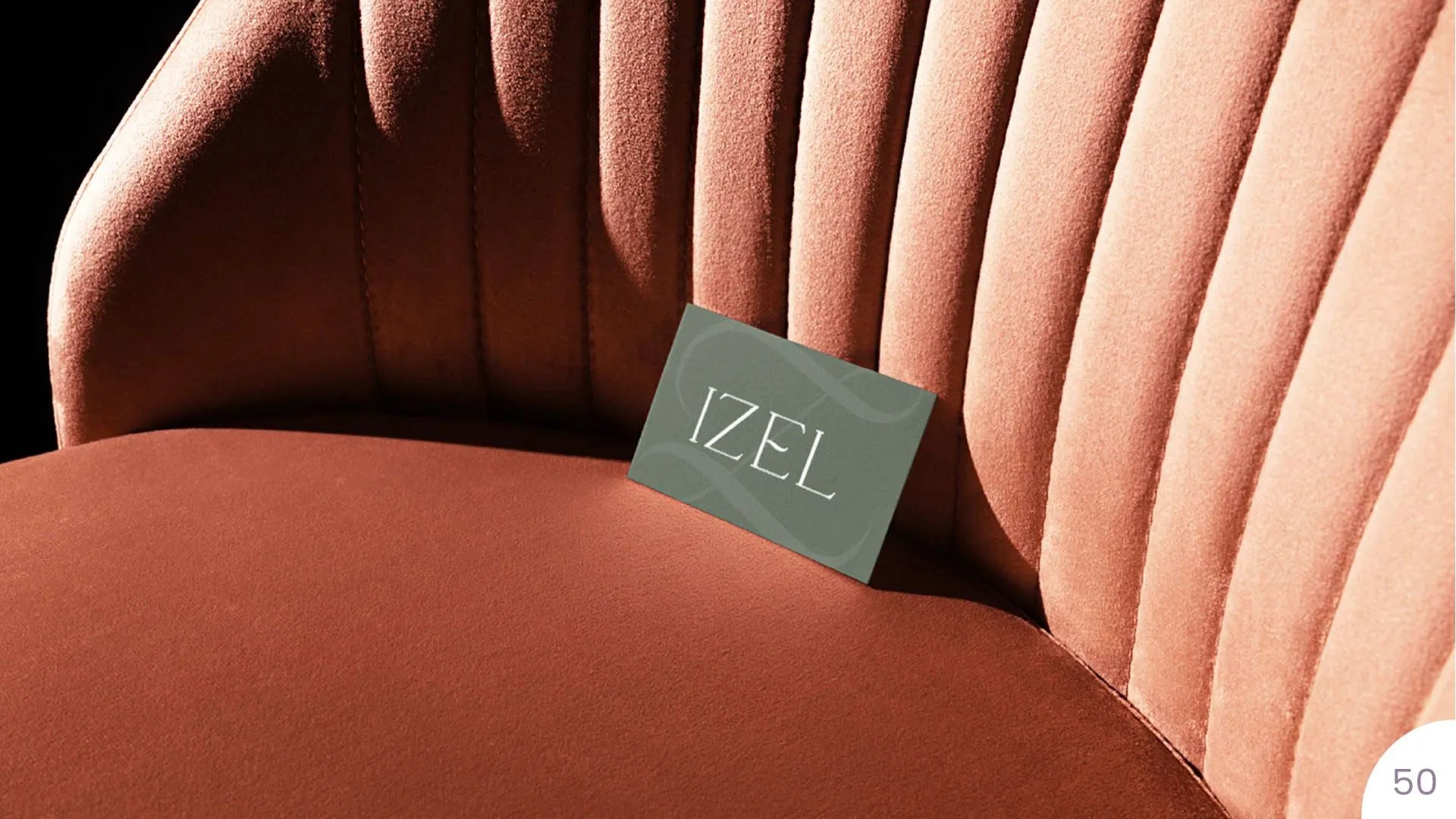 Izel business card on a velvet chair