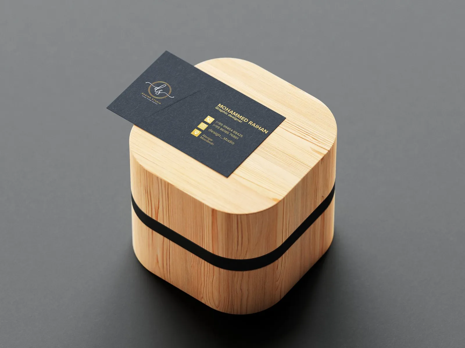 Mohammed Raihan’s business card on a wooden block
