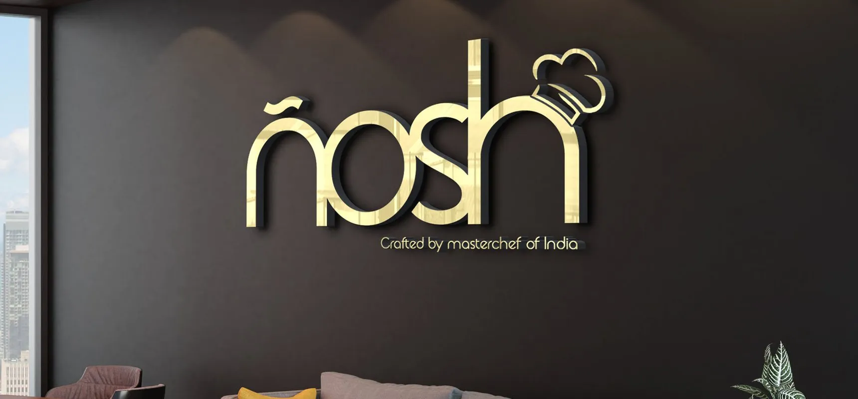 Nosh gold logo sign on a restaurant wall